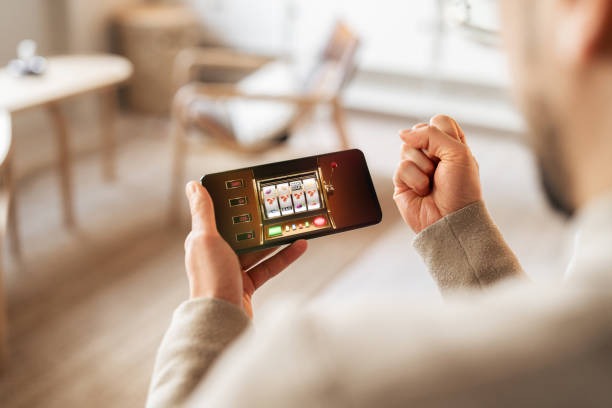 Hand holding phone with app menu